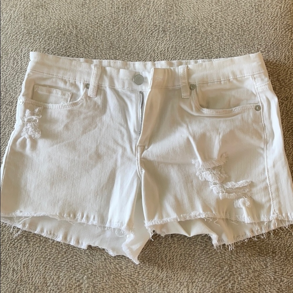 Distressed white shorts